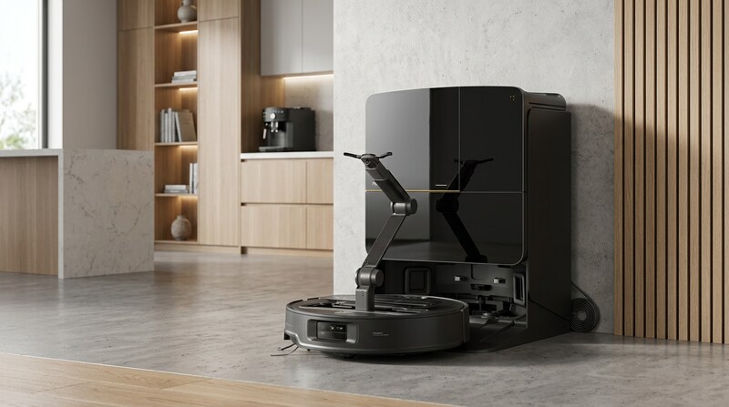 Roborock Saros Z70 robot vacuum with its robotic arm raised, next to its dark dock